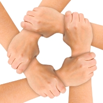 image of five hands linked together